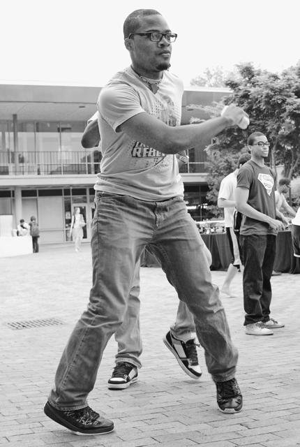 While at the Taste of N.C. State Gaivorlor Borbor, a junior in Mechanical Engineering, plays the new Wii game Just Dance 2. &#8220;This is a really cool game, if I had a Wii, I would but it,&#8221; Borbor said. Photo by Sarah Tudor