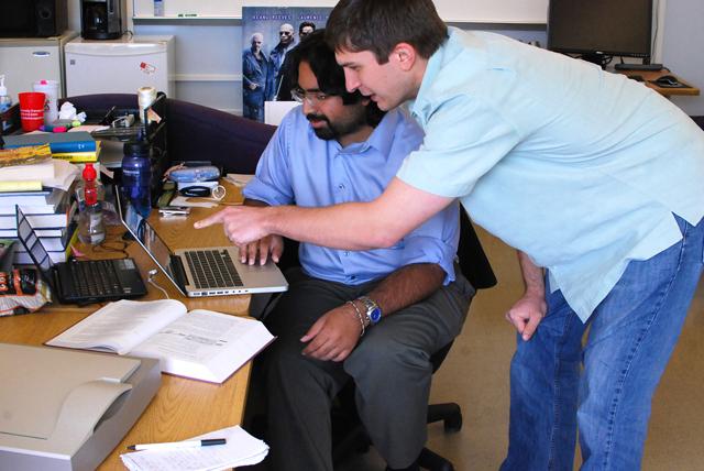 Jonathon Rowe and Alok Baikadi, graduate students in computer science, work together on the Narrative Theatre project. &#8220;[It's] a tool to help sixth grade writers to be more creative when writing fables.&#8221; Baikadi said, &#8220;They can write their story and see it in a new way.&#8221; Photo by Sarah Tudor.