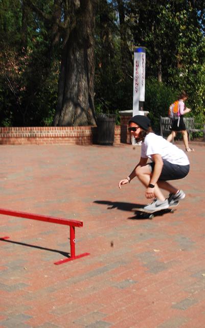 While skating in what is commonly known as the &#8220;Flat Spot&#8221; among N.C. State skateboarders, Patricia Carrow, a junior in marine biology, is about to ollie over a rail. &#8220;I&#8217;ve been riding around for years, but trick-wise, I just started in freshman year,&#8221; Carrow said. Photo by Sarah Tudor.