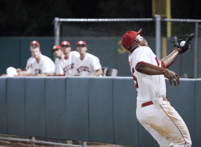 Junior infielder Harold Riggins secures a catch in the game against the Camels on Tuesday night. The Pack won, 3-2, over Campbell.