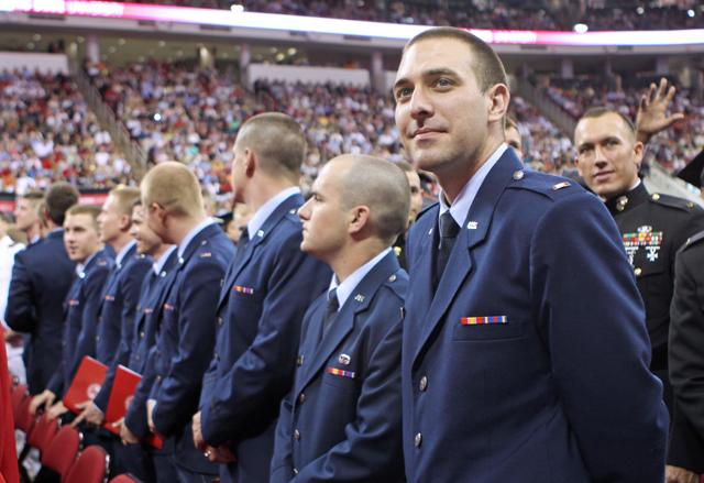 Justin White, a graduating senior in history, looks into the crowd at the RBC Center before commencement. White said he will definitely remember his commissioning ceremony held the night before and looks forward to serving in the Air Force. Photo by Patrick Easters