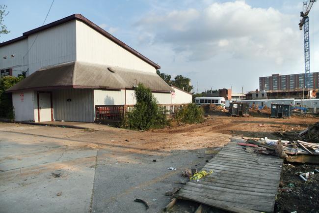 The Brewery sits in front of the construction site of a new housing development by Valentine Properties. The Brewery faces demolition Monday as part of a plan to develop a shopping center including a Kerr Drug. Photo by Patrick Easters