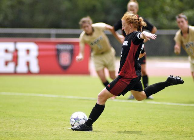 Alex Berger takes penalty kick in a game against Navy. Photo by Matt Nudi.