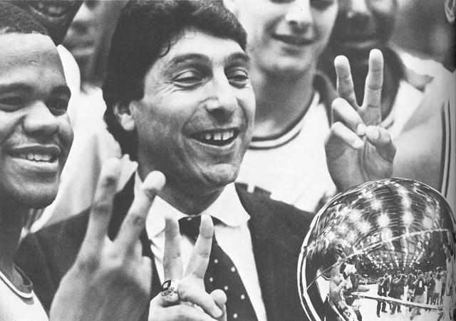 Former basketball coach Jim Valvano and the team celebrate after victory over David Robinson and Navy in the Tip-Off Classic. Photo courtesy of 1987 Agromeck.