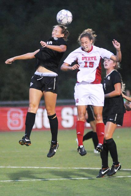 Kristina Argiroff, a midfielder attempts a header against the Wake Forest women's soccer team. Although the State team was the first to score a point, Wake Forest tied it up in the first half, then scored a second point in the second half, resulting in a Wake Forest win, 2-1. Photo by Nicole Moering.