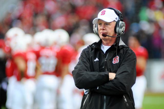 Coach Tom O'Brien looks out onto the field during a home game at Carter-Finley Stadium. Photo by Brent Kitchen.
