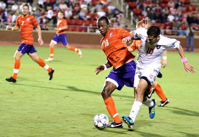 Redshirt freshman forward Nazmi Albadawi battles with a Clemson player for possession of the soccer ball on Friday. Photo by John Joyner.