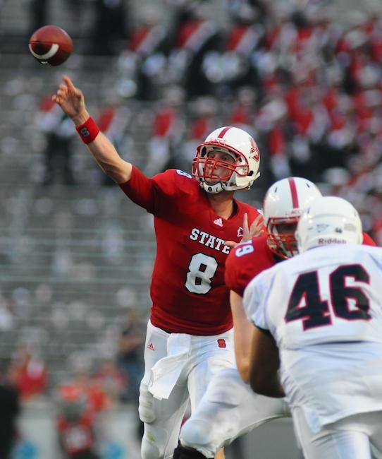 Quarterback Mike Glennon makes a throw during the football season opener against the Liberty Flames. Photo by Brent Kitchen.