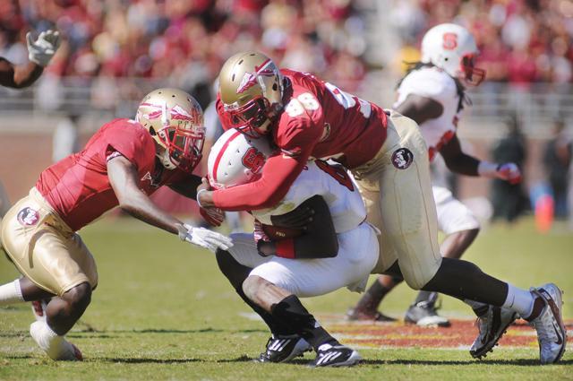 Junior defensive end McKay Frandsen reaches out to make a tackle on Florida State&#8217;s Jermaine Thomas in the second quarter of the game. The Wolfpack failed to put up any points against the Seminoles, losing 35-0. Photo by Jordan Moore.