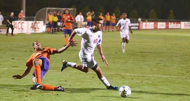 Freshman forward Nazmi Albadawi breaks away from a defender during a match-up against Clemson. Photo taken by John Joyner.