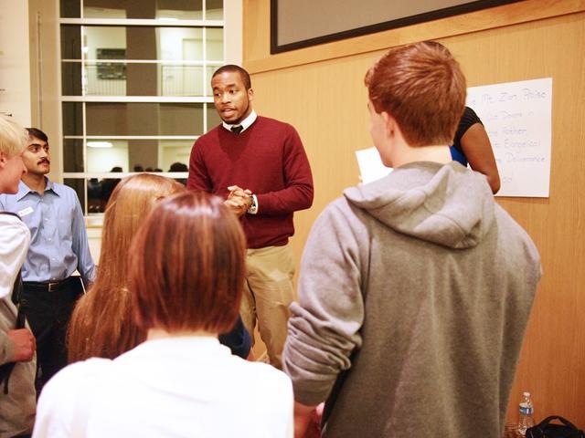 Business administration junior Chase Johnson portrays a discriminatory preacher in a role-playing exercise at Don't Hate the Player, Hate the Game in Riddick Lounge, Nov. 2. The event, hosted by CHASS Multicultural Association for Students and the Mu Xi Chapter of Zeta Phi Beta, held a discussion after the exercise to examine how stereotypes affect others. Photo by Andrew So.