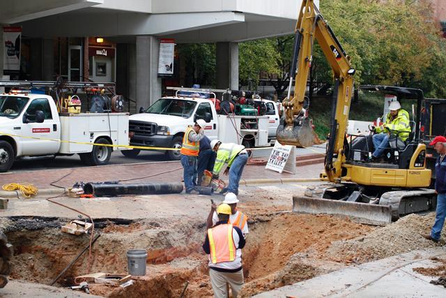 Construction workers fix a water main break outside Talley Student Center Oct. 19. A section of an old pipe under the road fell out due to large traffic flow, causing a &#8220;very substantial break in the pipe,&#8221; according to Erik Hall, a plant engineer for Facilities Operations. Photo by Oliver Sholder