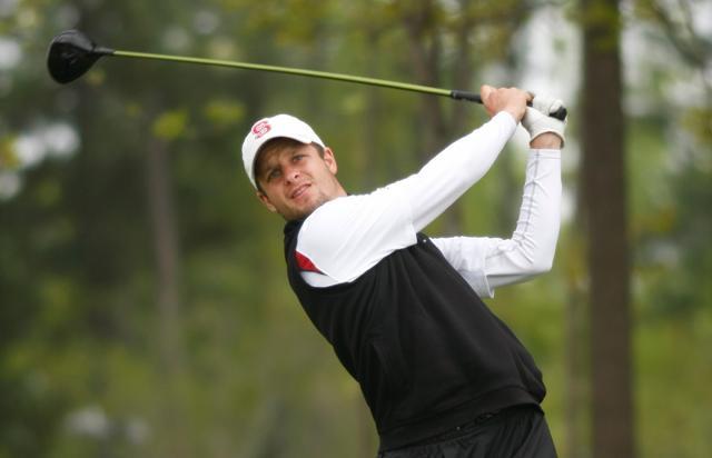 Graham Baillargeon drives his golfball across the 405 yard 16th hole at the Lonnie Poole golf course for the Wolfpack Spring Open April 16, 2011. The teams started an hour early in the stormy weather to avoid the tornado strength storms later in the day. Baillargeon was playing as an individual and shot 6-over 77, putting him in 27th. Photo by Tim O'Brien.