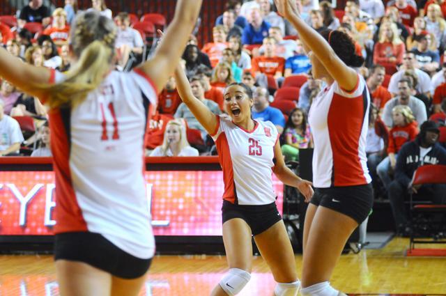 Junior defensive specialist Alexa Micek celebrates as the Pack defeated the Liberty Flames 3-0 at Reynolds Coliseum Friday, Sept. 16, 2011. State won all three of its matches in the Courtyard Midtown Classic giving the team a school-record tying 12 consecutive victories. Photo by Brent Kitchen.