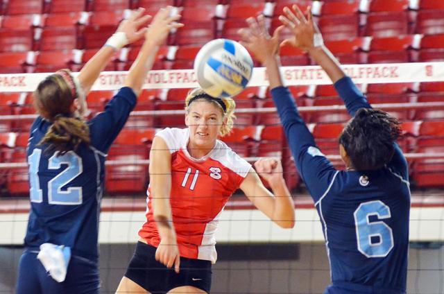 Senior middle blocker Margaret Salata spikes the ball in the game against Citadel Sept. 17, 2011. Salata scored a team-high 14.5 points and 12 kills in the 3-0 win, extending the Wolfpack's win streak to 11. Photo by Alex Sanchez.