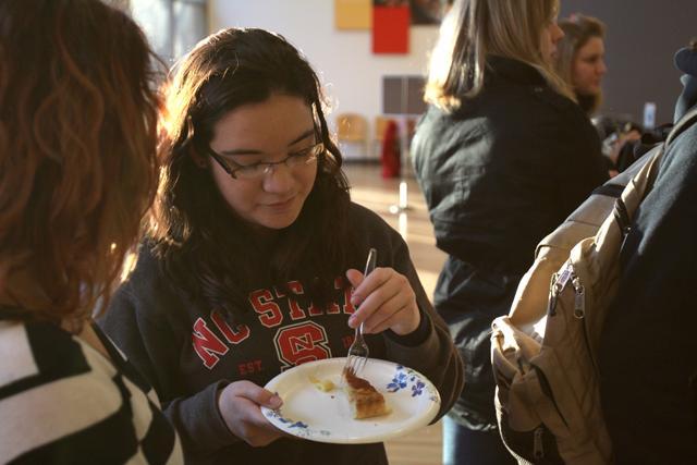 Joyska Nunez, a freshman history major, eats cake at the Fete de Rois in Caldwell Lounge on January 18th. Photo by Chris Phipps.