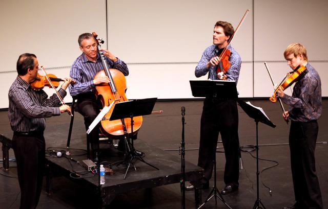 Getting into a groove, The Turtle Island Quartet performs their rendition of 'A Love Supreme' by jazz musician John Coltrane. The group recieved two Grammy awards, and is known for mixing musical styles and playing classical instruments in unconventional ways. Photo by Natalie Claunch
