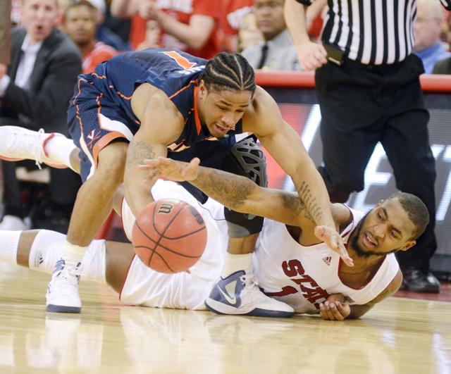 Fighting for the ball, junior Richard Howell reaches his arm for the ball. Howell had a double-double in Saturday's 61-60 loss to Virginia with 18 rebounds and 11 points. Photo by Ryan Parry.