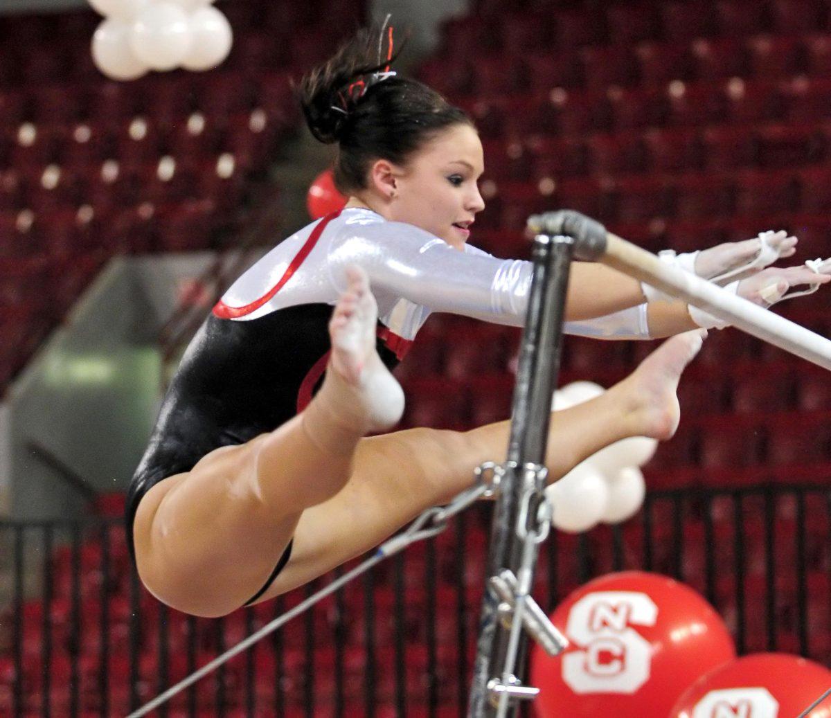 Junior Gymnast Rachel Fincham swings on the bars