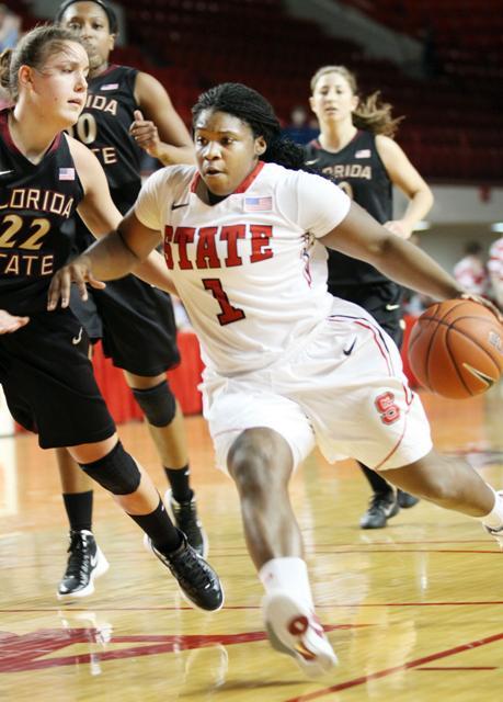 Myisha Goodwin-Coleman, a sophomore guard, aggressively drives to the basket for a lay-up versus FSU at Reynolds Coliseum Fri. Jan. 27. Despite NCSU's loss against FSU Goodwin-Coleman made the most baskets, totaling 17 points, putting up a good fight with a final score of 67- 64. Photo by Callie Martin.