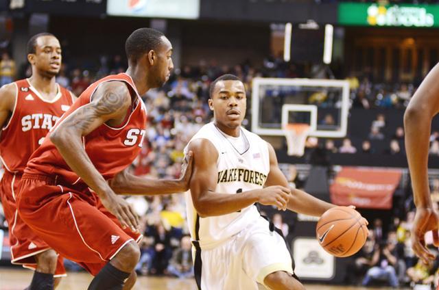 Sophomore forward C.J. Leslie defends against Wake Forest sophomore guard Tony Chennault during the