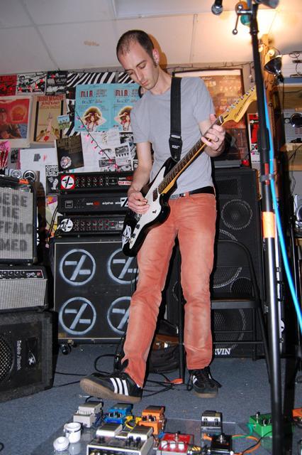 Corbie Hill, a senior in English, practices with his band Alpha Cop, Jan. 25. Because of the strong local music scene in Raleigh, Hill found his bandmates and continues to use Alpha Cop as an outlet for his passion of music. Photo by Jade Loring