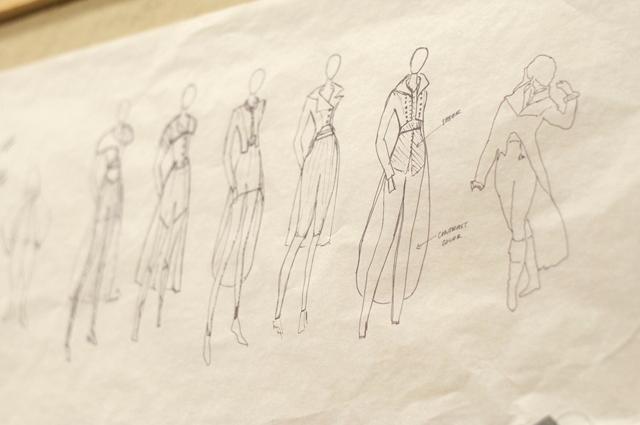 Sketches by Sarah Canon, a sophomore in art and design, hang on an idea board for her Art to Wear 2012 collection. Her designs emphasize classic silhouettes while focusing on modern material. Photo by Charlle Harless