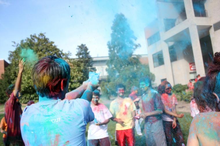 Holi, the Hindu "festival of colors," is observed by students as they throw handfuls of colored powder into the air on Harris Field Friday, March 16. Photo by Brett Morris.