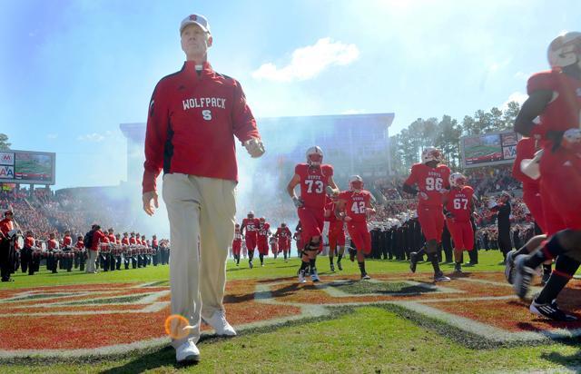 Coach Tom O'Brien walks onto the field with his team prior to its game against UNC at Carter-Finley Stadium Saturday, Nov. 5. O'Brien has led State to five-consecutive victories over the Tar Heels. Photo by Brent Kitchen.