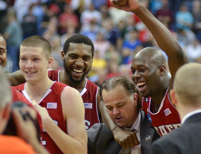 Junior forwards Scott Wood, Richard Howell and DeShawn Painter celebrate after the Pack's 66-63 win over Georgetown on Sunday in the third round of the NCAA Tournament. Photo by Alex Sanchez.