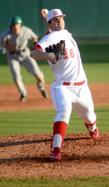 Throwing a fastball, freshman pitcher Carlos Rodon throws the ball down the center for a strike. Rodon got his first win of the season after coming into the game in the fourth inning during the Wolfpack&#8217;s 10-3 win over Marshall on Friday. Photo by Ryan Parry.