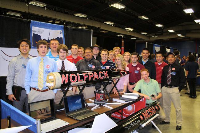 The 2011 N.C. State Rocketry Team poses with its rocket at a competition hosted by NASA last April. The team will return to the competition with a new rocket that can reach an altitude of 5,800 feet. Photo courtesy of N.C. State Rocketry Team