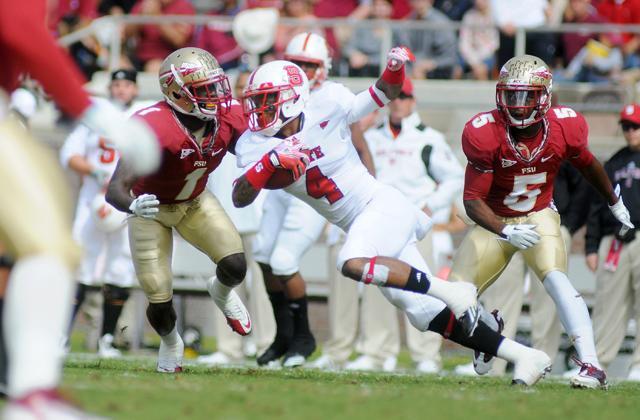 Redshirt senior wide receiver Tobais Palmer rushes for a few yards in the first quarter of the N.C. State, FSU game on, Oct. 29, 2011. The Wolfpack struggled all day against the Seminoles, only putting up 166 yards and scoring no points. Photo by Jordan Moore. Technician archive photo.