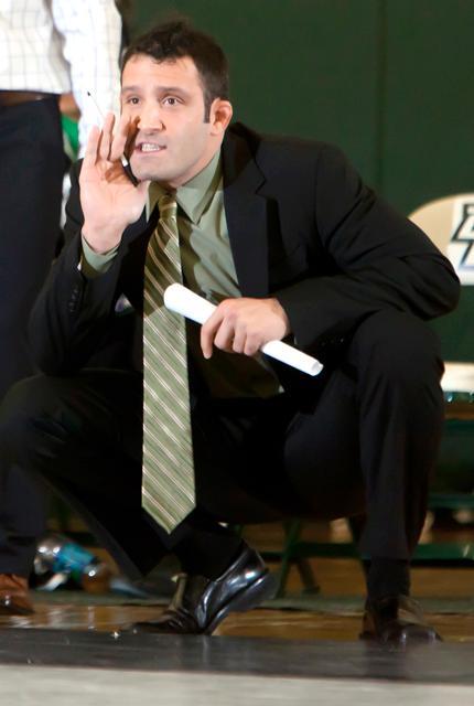 New Wolfpack head coach Pat Popolizio yells at his former team during a match at the West Gym on Saturday, November 12, 2011.