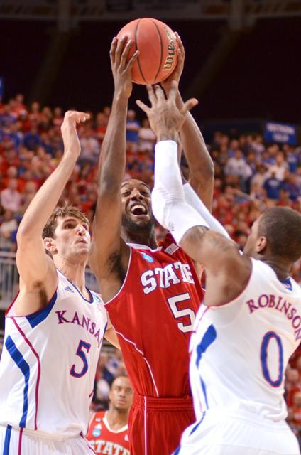 Sophomore forward C.J. Leslie puts up a shot over Jeff Withey and Thomas Robinson during the Sweet 16 game against Kansas Friday, March 23, 2012. Leslie scored 18 with 4 rebounds in the 60-57 Wolfpack loss. Photo by Alex Sanchez.