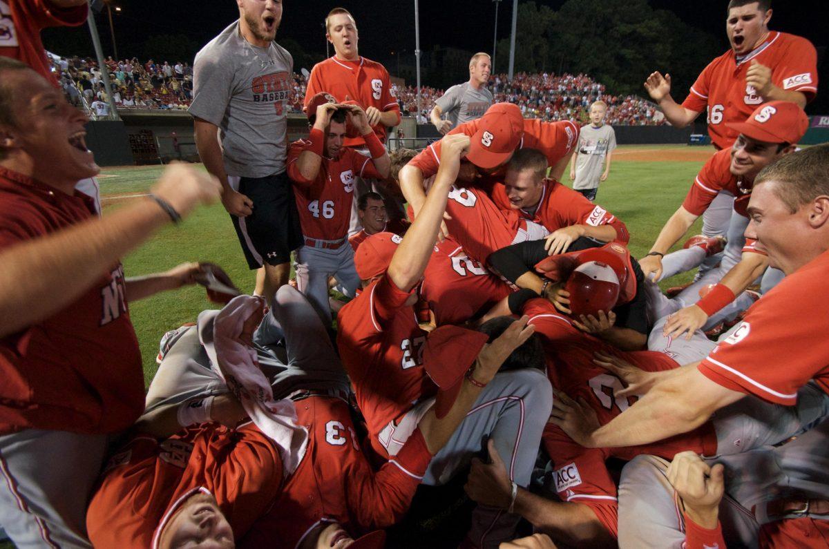 The N.C. State baseball team celebrates after qualifying for the NCAA tournament. Photo by Charlie Harless