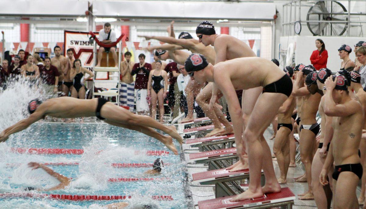 Photo by Joannah Irvin. Freshman freestyle swimmer Louis Wojciechowski prepares to swim the second leg of the 400 freestyle relay on Wednesday Jan. 16 against Virginia Tech. The Wolfpack men's swimming and diving team tied with the Hokies with a score of 150 points, improving their record to 6-3-1. The Wolfpack's next home meet will take place on Saturday Jan. 19 against Florida State and Georgia Tech.
