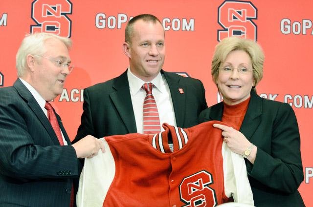 Athletic director Debbie Yow and Chancellor Randy Woodson present new head football coach Dave Doeren with a letter jacket during his introduction in the Murphy Center at Carter-Finley Stadium Saturday Dec. 2, 2012.