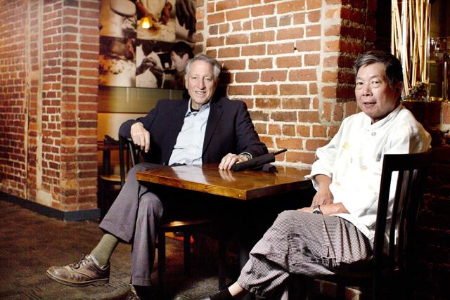 Professor Hal Hopfenberg and chef David Mao sit at David&#8217;s Dumpling and Noodle Bar. The two have been friends since Hopfenberg was deployed to Vietnam in 1966.