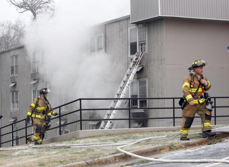 Firefighters work the scene of an apartment fire Friday, January 25, 2013, at Mission Valley Apartments at the intersection of Avent Ferry Road and Centennial Parkway in Raleigh. Several people were transported to area hospitals after suffering smoke inhalation. More than two dozen people were left homeless.