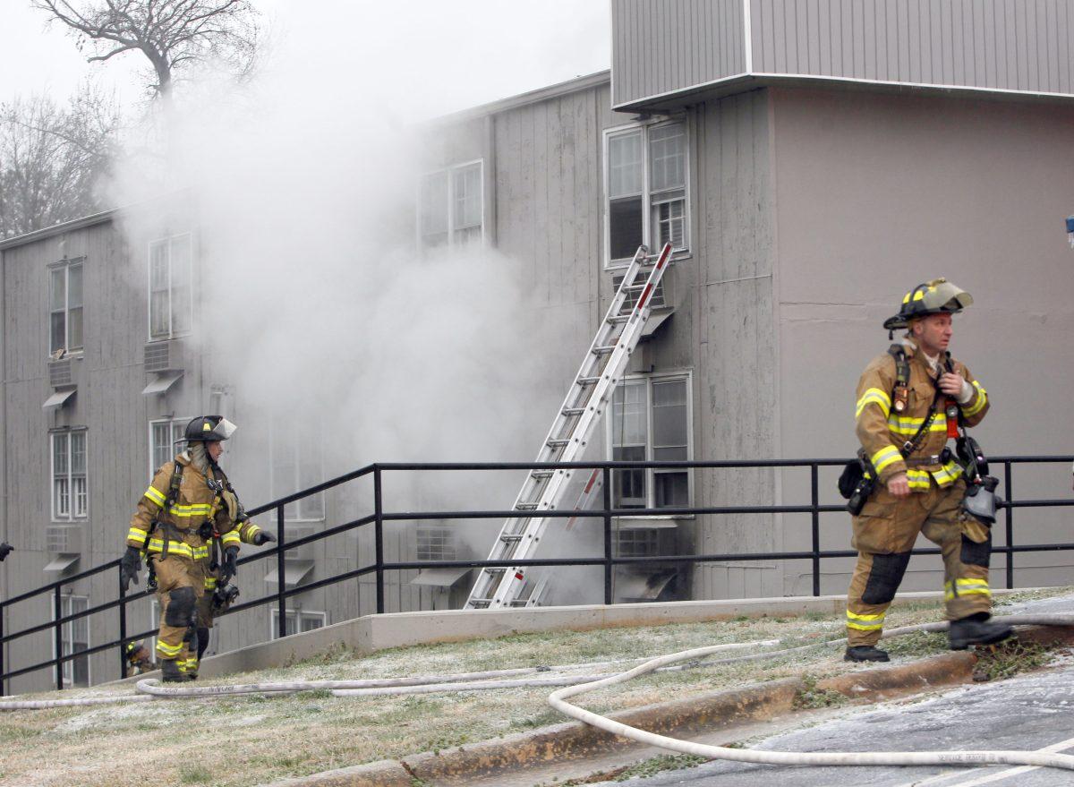 Firefighters work the scene of an apartment fire Friday, January 25, 2013, at Mission Valley Apartments at the intersection of Avent Ferry Road and Centennial Parkway in Raleigh. Several people were transported to area hospitals after suffering smoke inhalation. More than two dozen people were left homeless.