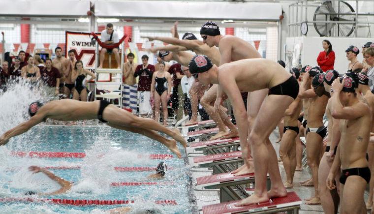 Photo by Joannah Irvin. Freshman freestyle swimmer Louis Wojciechowski prepares to swim the second leg of the 400 freestyle relay on Wednesday Jan. 16 against Virginia Tech. The Wolfpack men's swimming and diving team tied with the Hokies with a score of 150 points, improving their record to 6-3-1. The Wolfpack's next home meet will take place on Saturday Jan. 19 against Florida State and Georgia Tech.