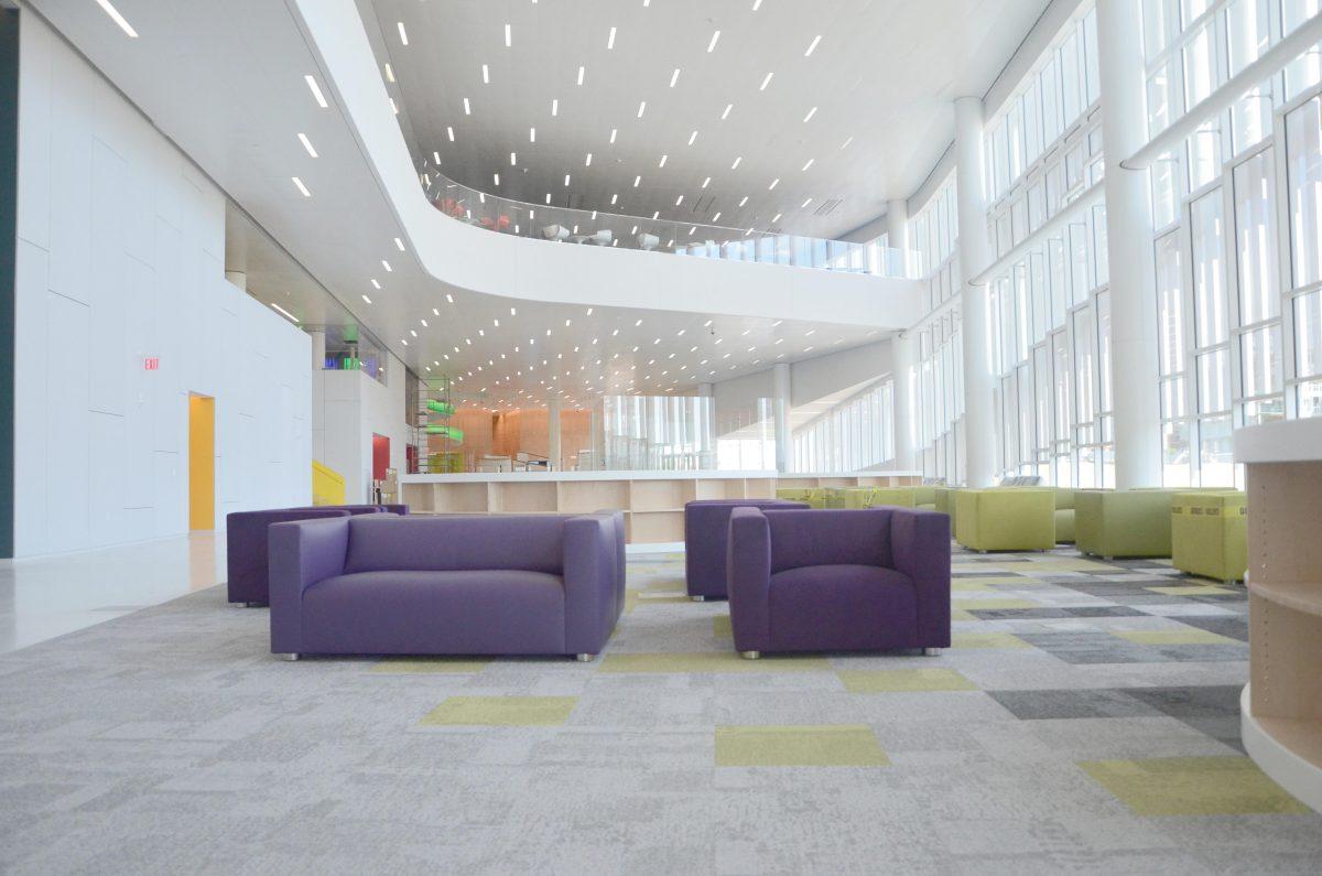 The attrium on the main level of the Hunt Library features chairs and space for students to sit and relax with friends or work on homework. The Hunt Library features new technology that has never been used on college campuses before. Photo by Ryan Parry.