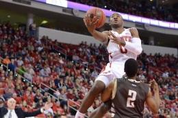 Freshman guard Rodney Purvis skies over Bonnies guard Eric Mosley. Purvis finished the game with nine points.