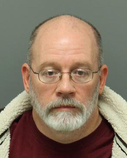 University employee charged with weapons possession