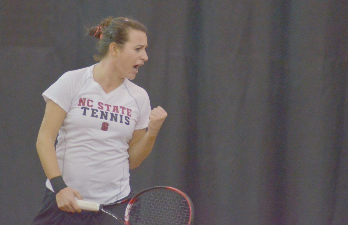 Senior Tatiana Illova celebrates a point during her doubles match with junior Joelle Kissell against East Carolina Thursday, Jan. 31, 2013. Illova and Kissell lost their match 8-6 at the J.W. Isenhour Tennis Center.