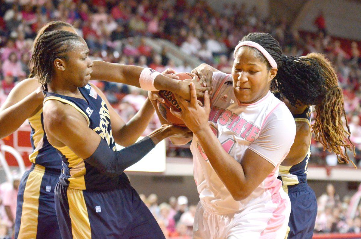Junior center Markeisha Gatling fights for posession of the ball during the eighth annual Hoops 4 Hope basketball game against Georgia Tech in Reynolds Coliseum Sunday, Feb. 17, 2013. The Wolfpack Women fell 79-70 to the Yellow Jackets. Photo by John Joyner.