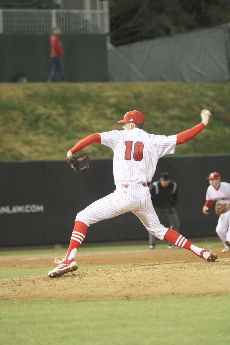 Photo by Joannah Irvin. Senior relief pitcher, Ethan Ogburn, throws the ball during the 5-0 victory over UNC-Charlotte on Tuesday Feb. 19 2013. The Wolfpack win improved the overall record to 1-1. The next home appearance will occur on Friday Feb. 3 2013 against Villanova at 3 pm.