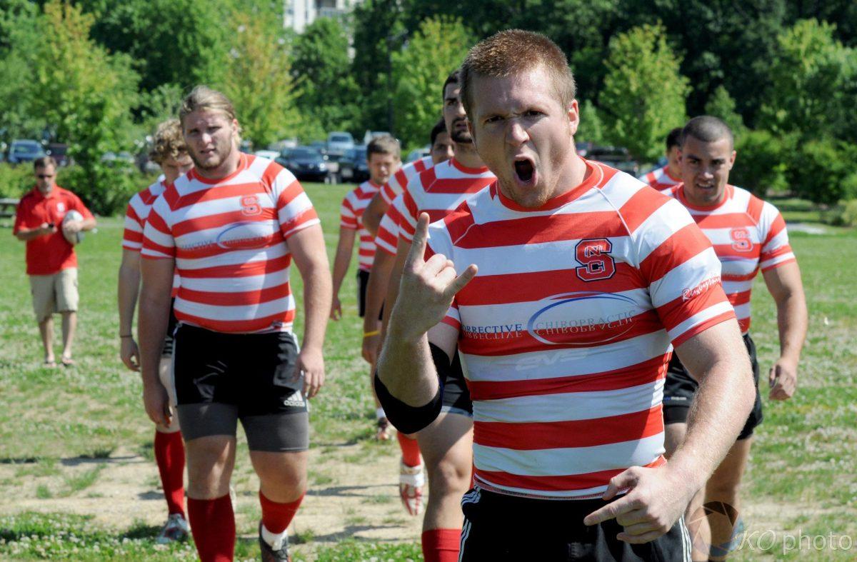 Members of the N.C. State men's rugby team celebrate after a victory.