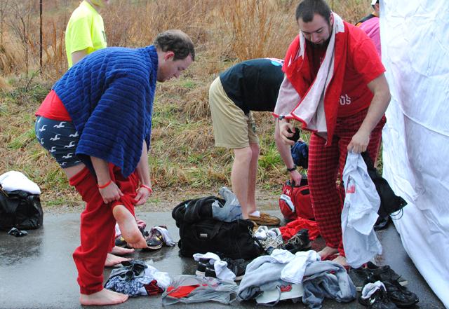 Jesse Simmons, junior in business administration and Kenny Hertling, junior in political science change into dry clothes after the N.C. State Polar Plunge Saturday, Feb. 23. "The first step was not bad, but once I dove under, I couldn't feel any part of my body. Out of the water felt so much warmer," Hertling said. The event raises money for Special Olympics North Carolina. Photo by Natalie Claunch